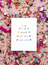 I am proud of you rainbow LGBTQ+ Pride card.  Delicate multi color hearts around the Title in a rainbow fashion