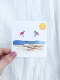pink flamingo stud earrings on beach card